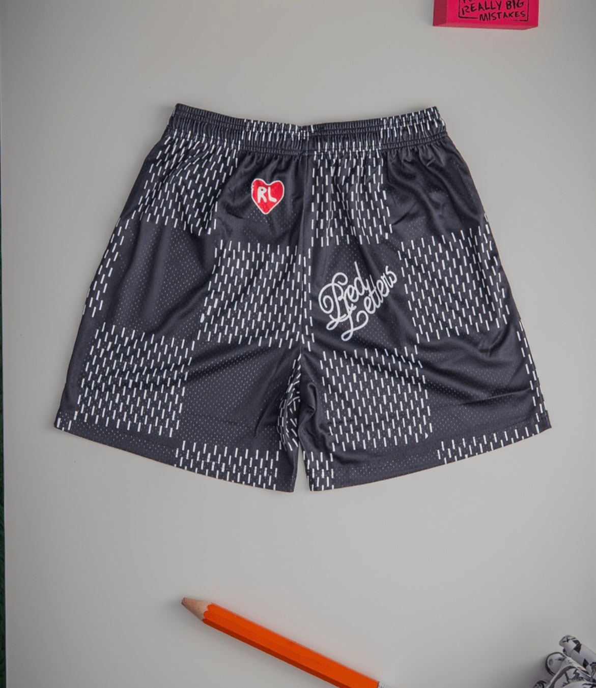 Red Letters Checkered Mesh Shorts Black